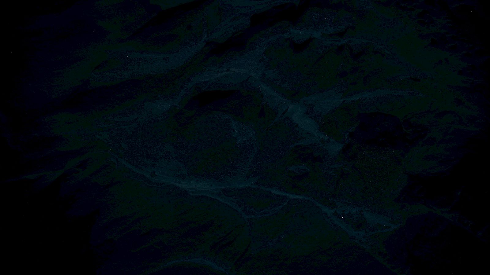 The image is very dark, making it difficult to discern details. It might require adjusting brightness or contrast to see clearly.
